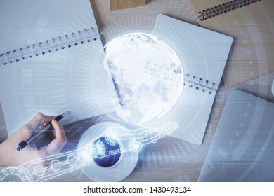 Multi exposure of hands making notes with world map hologram and data theme icons. Concept of global data.