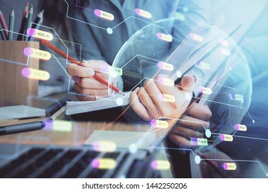 Multi exposure of hands making notes with world map hologram and data theme icons. Concept of global computer data.