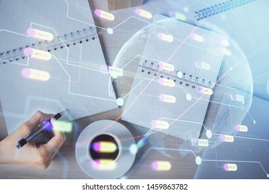 Multi exposure of hands making notes with world map hologram and data theme icons. Concept of global data. - Powered by Shutterstock - Get 15% off with code: PIKWIZARD15