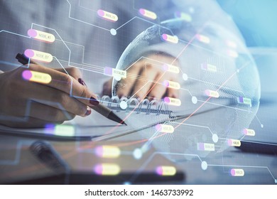 Multi exposure of hands making notes with world map hologram and data theme icons. Concept of global data.