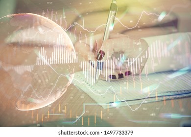 Multi exposure of hands making notes with forex chart huds. Stock market concept.