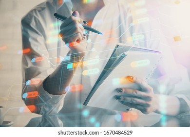 Multi exposure of hands making notes with digital coding icons. Computer learning concept.