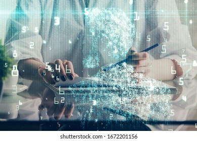 Multi exposure of hands making notes with digital coding icons. Computer learning concept.