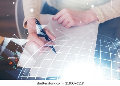 Multi exposure of hands making notes with world map hologram and data theme icons. Concept of global computer data.