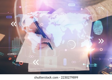 Multi exposure of hands making notes with world map hologram and data theme icons. Concept of global computer data.