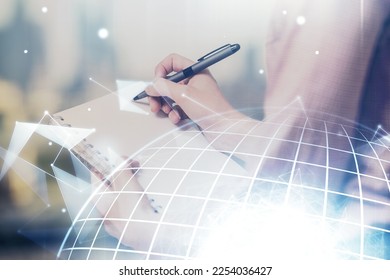 Multi exposure of hands making notes with world map hologram and data theme icons. Concept of global data.