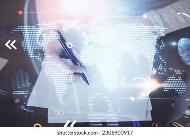 Multi exposure of hands making notes with world map hologram and data theme icons. Concept of global computer data.