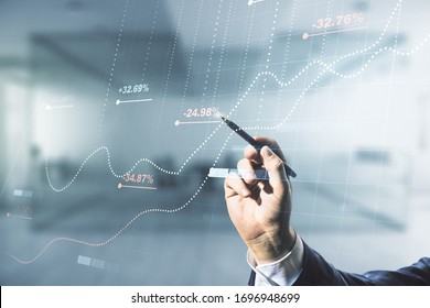 Multi exposure of male hand with pen working with abstract virtual graphic data spreadsheet sketch on blurred office background, analytics and analysis concept - Shutterstock ID 1696948699