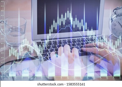 Multi exposure of market chart with man working on computer on background. Concept of financial analysis. - Shutterstock ID 1583555161