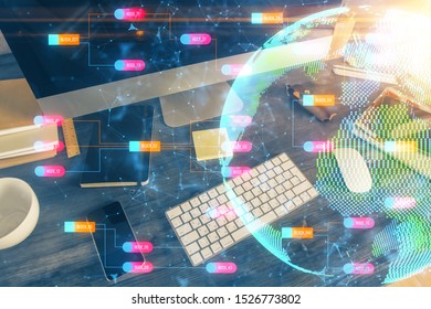 Multi exposure of table with computer and world map hologram. International data network concept.