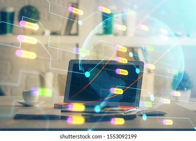 Multi exposure of table with computer and world map hologram. International data network concept.