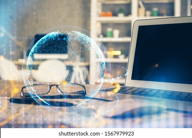 Multi exposure of table with computer and world map hologram. International data network concept.