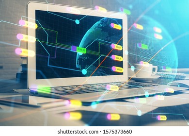 Multi exposure of table with computer and world map hologram. International data network concept.