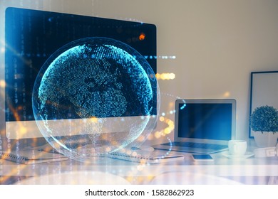 Multi exposure of table with computer and world map hologram. International data network concept.