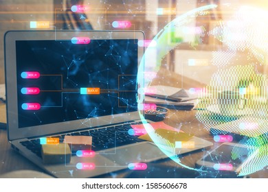 Multi exposure of table with computer and world map hologram. International data network concept.