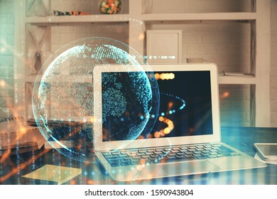 Multi exposure of table with computer and world map hologram. International data network concept.
