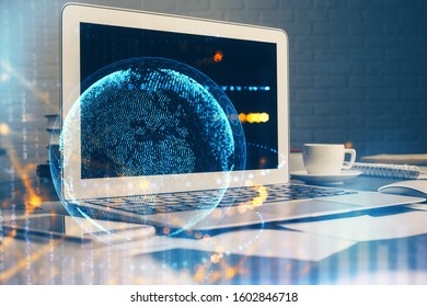 Multi exposure of table with computer and world map hologram. International data network concept.