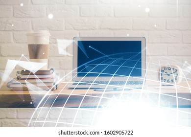 Multi exposure of table with computer and world map hologram. International data network concept.