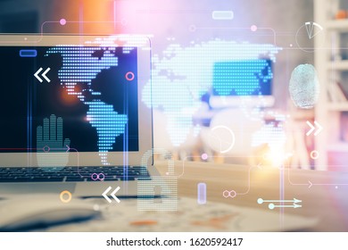 Multi exposure of table with computer and world map hologram. International data network concept.