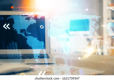 Multi exposure of table with computer and world map hologram. International data network concept.