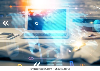 Multi exposure of table with computer and world map hologram. International data network concept.