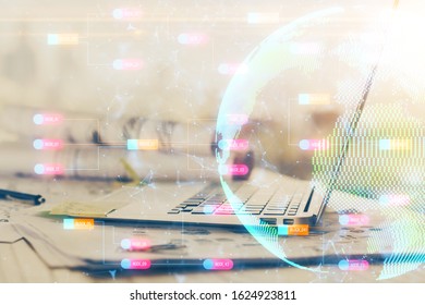 Multi exposure of table with computer and world map hologram. International data network concept.