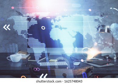 Multi exposure of table with computer and world map hologram. International data network concept.