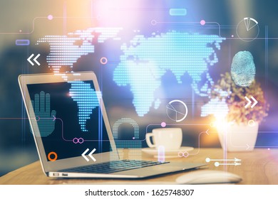 Multi exposure of table with computer and world map hologram. International data network concept.