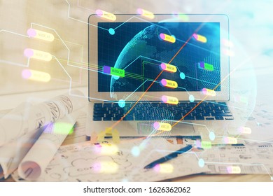 Multi exposure of table with computer and world map hologram. International data network concept.