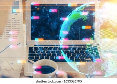 Multi exposure of table with computer and world map hologram. International data network concept.