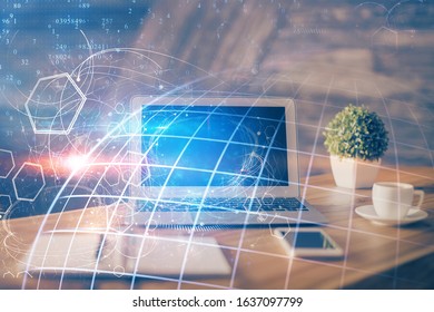 Multi exposure of table with computer and world map hologram. International data network concept.