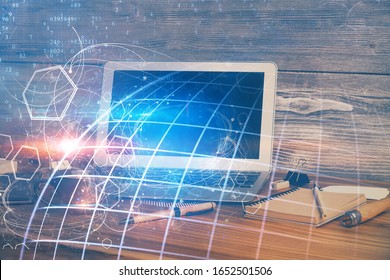 Multi exposure of table with computer and world map hologram. International data network concept.