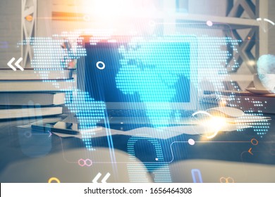 Multi exposure of table with computer and world map hologram. International data network concept.