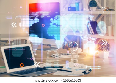 Multi exposure of table with computer and world map hologram. International data network concept.