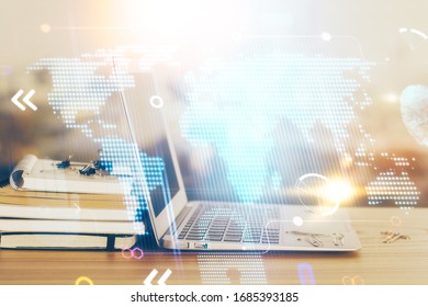 Multi exposure of table with computer and world map hologram. International data network concept.
