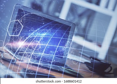 Multi exposure of table with computer and world map hologram. International data network concept.