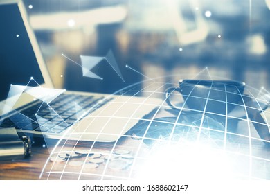 Multi exposure of table with computer and world map hologram. International data network concept.