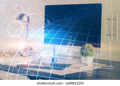 Multi exposure of table with computer and world map hologram. International data network concept.