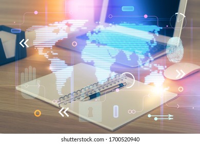 Multi exposure of table with computer and world map hologram. International data network concept.