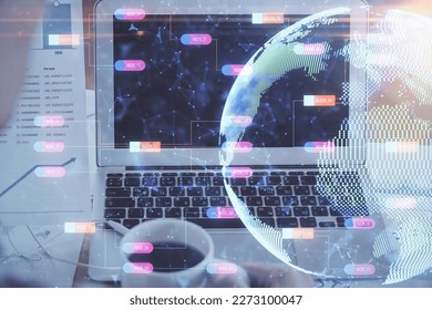Multi exposure of table with computer and world map hologram. International data network concept.