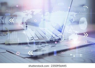 Multi exposure of table with computer and world map hologram. International data network concept.