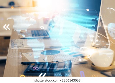 Multi exposure of table with computer and world map hologram. International data network concept.