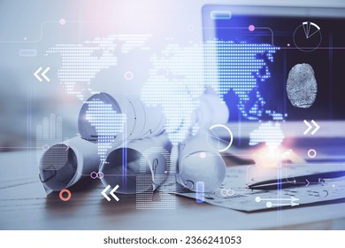 Multi exposure of table with computer and world map hologram. International data network concept.