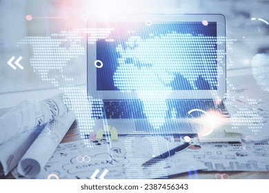 Multi exposure of table with computer and world map hologram. International data network concept.