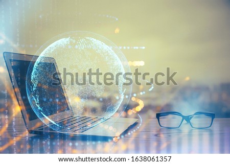 Multi exposure of table with computer and world map hologram. International data network concept.