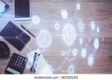 Multi exposure of technology theme drawing over work table desktop. Top view. Global data analysis concept.