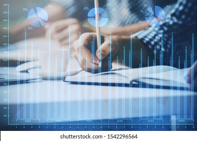 Multi exposure of two men planing investment with stock market forex chart. - Shutterstock ID 1542296564