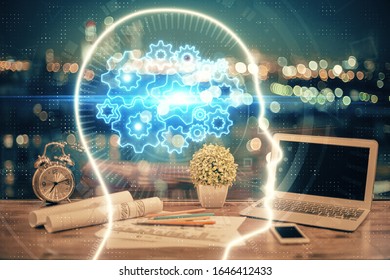 Multi exposure of work table with computer and brain hologram. Brainstorm concept.