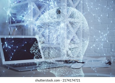 Multi exposure of work table with computer and brain hologram. Brainstorm concept.