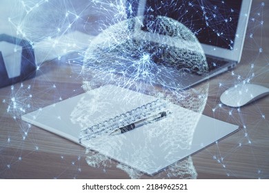 Multi exposure of work table with computer and brain hologram. Brainstorm concept.